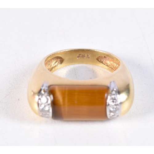 1151 - AN 18CT GOLD DIAMOND AND TIGERS EYE RING. M. 9.5 grams.