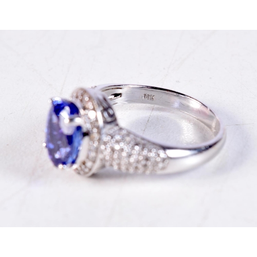 1155 - AN 18CT GOLD DIAMOND AND TANZANITE RING. R. 6.6 grams.