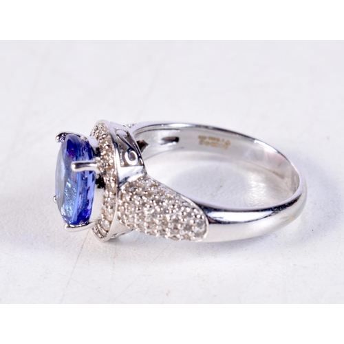 1155 - AN 18CT GOLD DIAMOND AND TANZANITE RING. R. 6.6 grams.