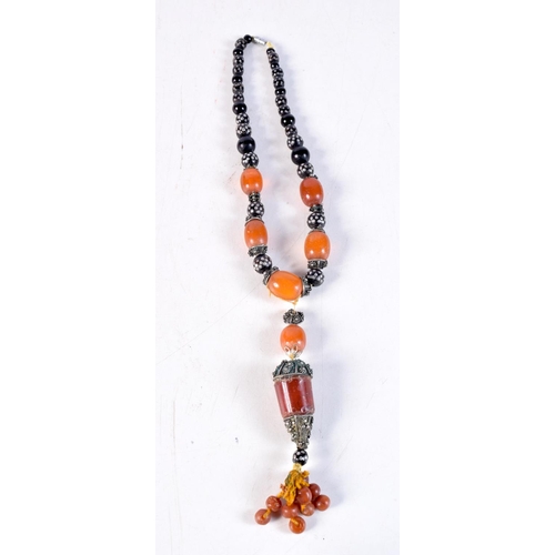 1163 - AN ANTIQUE MIDDLE EASTERN AMBER NECKLACE. 73 grams. 41 cm long.