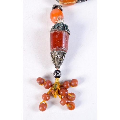 1163 - AN ANTIQUE MIDDLE EASTERN AMBER NECKLACE. 73 grams. 41 cm long.