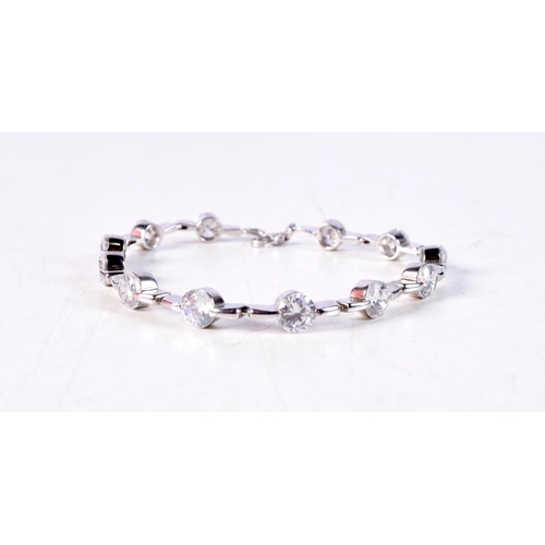 1177 - A SILVER CZ BRACELET. 18 grams. 15 cm long.