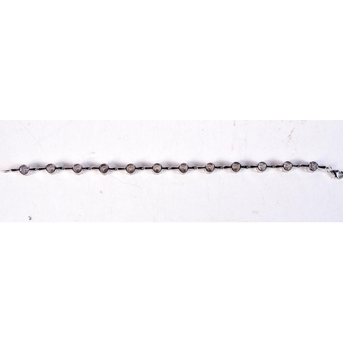 1177 - A SILVER CZ BRACELET. 18 grams. 15 cm long.