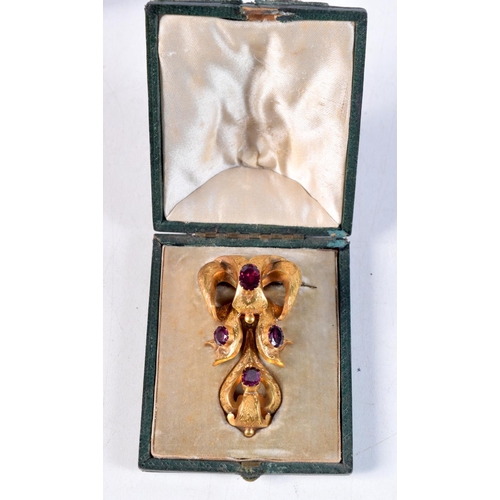 1200 - A VICTORIAN YELLOW METAL AND AMETHYST BROOCH. 9.8 grams. 6 cm x 3.25 cm.