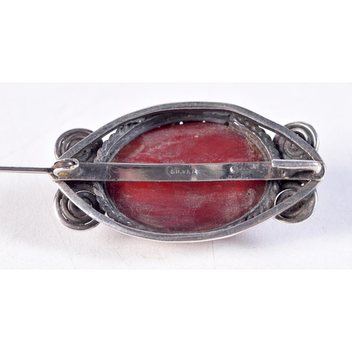 1201 - A VINTAGE CHERRY AMBER TYPE SILVER BROOCH. 5 cm x 3 cm.