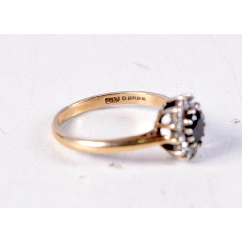 1251 - A 9CT GOLD AND DIAMOND RING. 2 grams. K/L.