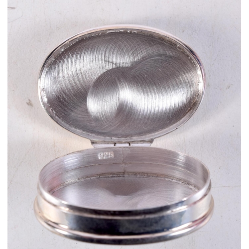 1296 - A SILVER RACING CAR PILL BOX. 19 grams. 3.75 cm x 2.5 cm.