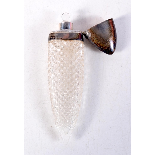 1299 - AN UNUSUAL SILVER MOUNTED CUT GLASS SCENT BOTTLE. 44 grams. 11.5 cm x 3 cm.