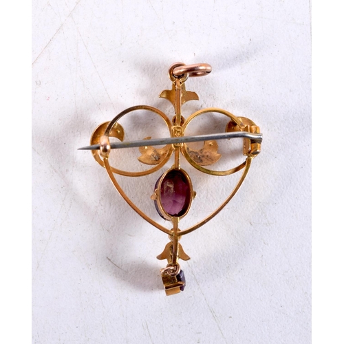 1302 - A 9CT GOLD AND AMETHYST BROOCH. 3 grams. 4.25 cm x 2.5 cm.