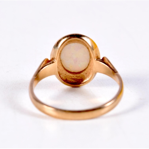 1303 - A 9CT GOLD AND OPAL RING. 3 grams. Q.