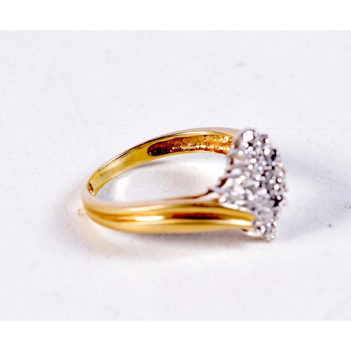 1343 - A 10CT GOLD AND DIAMOND CLUSTER RING. 2.9 grams. O.