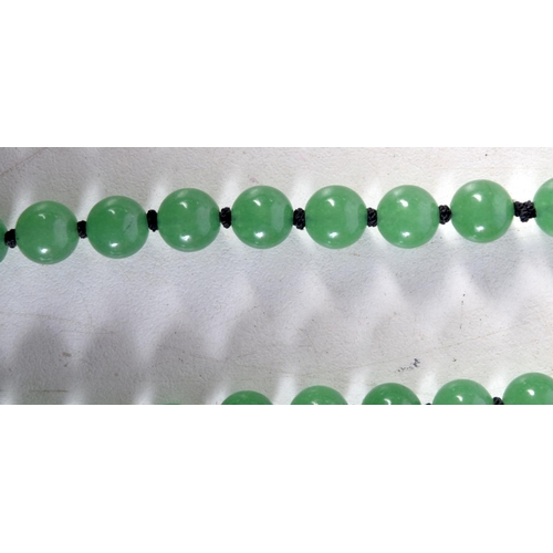 1359 - A JADE NECKLACE. 57 grams. 70 cm long.