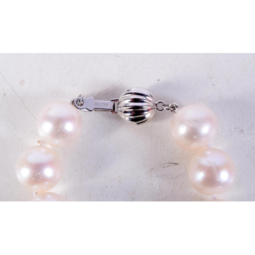 1360 - AN 18CT WHITE GOLD PEARL AND DIAMOND NECKLACE. 73 grams. 47 cm long.