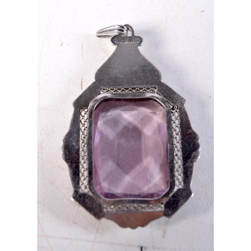 1370 - A SILVER AND AMETHYST PENDANT. 13.3 grams. 5.5 cm x 3 cm.