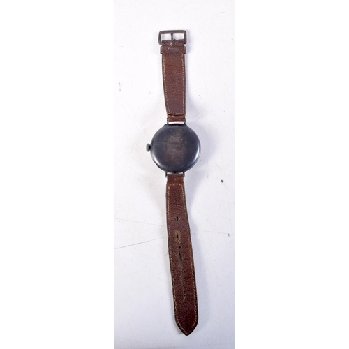 1373 - AN ANTIQUE SILVER AND ENAMEL TRENCH TYPE WATCH. 3.75 cm wide.