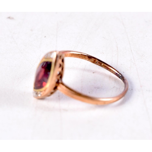 1385 - AN ANTIQUE YELLOW METAL AND RUBY RING possibly Russian. J. 1.9 grams.