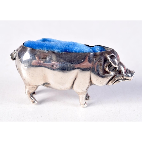 1439 - AN EDWARDIAN SILVER PIG PIN CUSHION. 7.2 grams. Birmingham 1905. 4.75 cm x 2.5 cm.