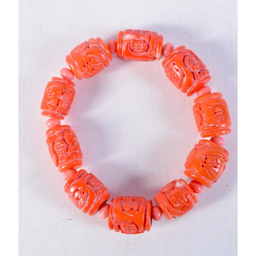 1449 - A CHINESE CORAL BRACELET. 47 grams. 5.25 cm wide.