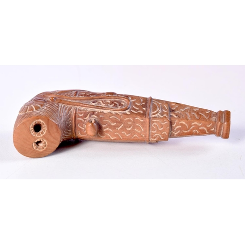 1452 - A JAPANESE BOXWOOD PISTOL NETSUKE. 10 cm x 4.25 cm.