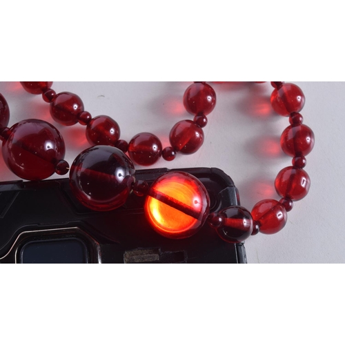 1466 - A CHERRY AMBER TYPE NECKLACE. 111 grams. 63 cm long.