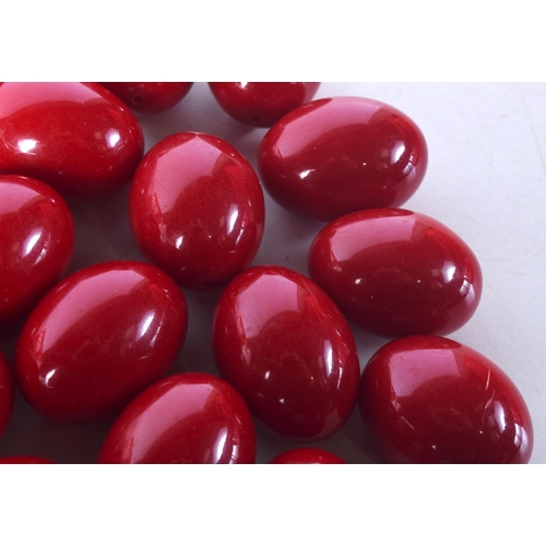 1477 - LARGE CHERRY AMBER TYPE BEADS. 630 grams. 3.75 cm x 3 cm. (qty)