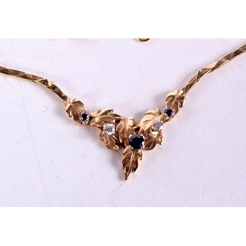 1519 - A 9CT GOLD DIAMOND AND SAPPHIRE NECKLACE. 9 grams. 40 cm long.