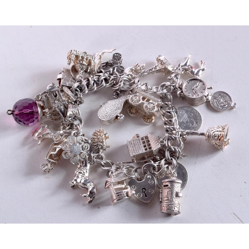 1531 - A SILVER CHARM BRACELET. 95 grams. 4.5 cm internal width.