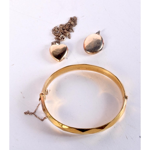 1533 - A YELLOW METAL BANGLE and two pendants. 44 grams. Largest 5.5 cm x 6.25 cm. (3)