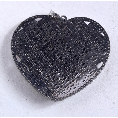 1593 - A SILVER AND DIAMOND HEART PENDANT. 12 grams. 4.25 cm wide.