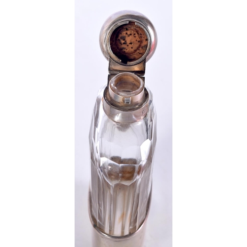 1604 - A VICTORIAN SILVER MOUNTED HIP FLASK. London 1899. 319 grams inc glass. 14.5 cm x 7 cm.