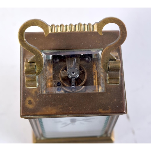 1612 - A MINIATURE ANTIQUE CARRIAGE CLOCK. 7.75 cm x 4 cm.