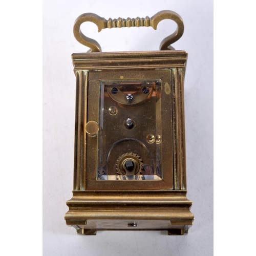 1612 - A MINIATURE ANTIQUE CARRIAGE CLOCK. 7.75 cm x 4 cm.