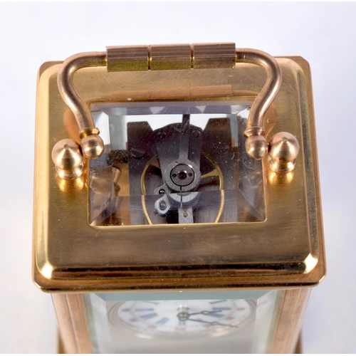 1613 - A MINIATURE CARRIAGE CLOCK. 7.75 cm x 4 cm.