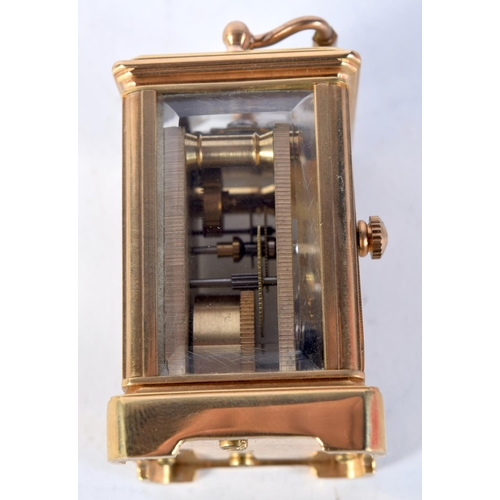 1613 - A MINIATURE CARRIAGE CLOCK. 7.75 cm x 4 cm.