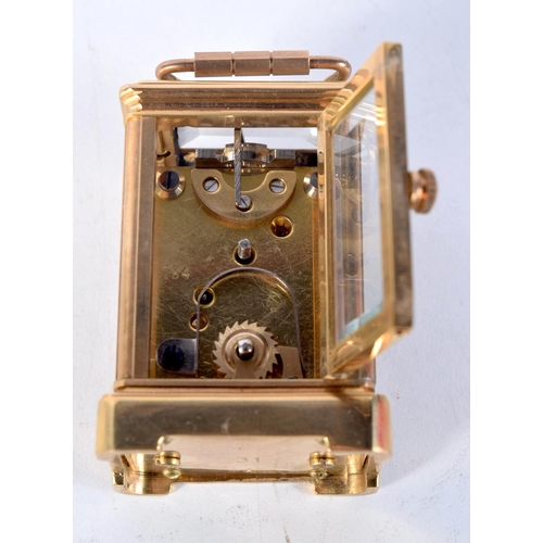 1613 - A MINIATURE CARRIAGE CLOCK. 7.75 cm x 4 cm.