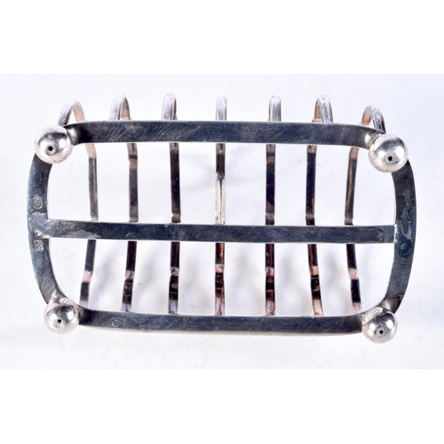 1687 - AN ART DECO SILVER TOAST RACK. 152 grams. 13 cm x 11.5 cm.