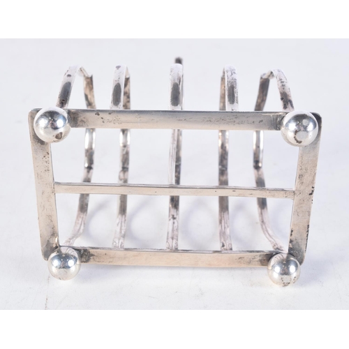 1705 - AN ART DECO SILVER TOAST RACK. 118 grams. 12 cm x 9.5 cm.