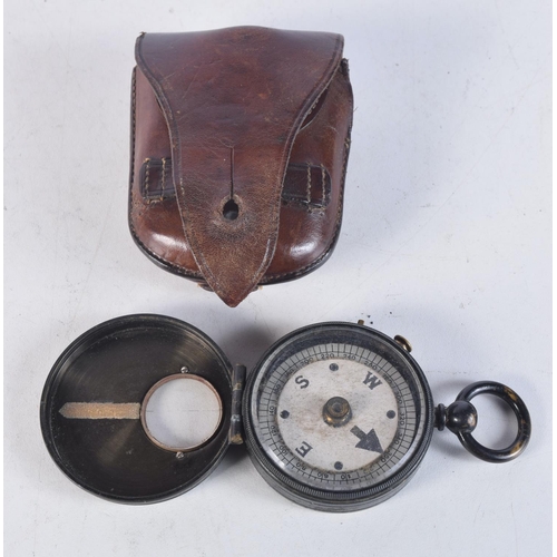 1738 - A MILITARY POCKET COMPASS. 5 cm x 2 cm.