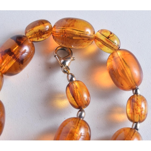 1743 - AN AMBER NECKLACE. 47 grams. 57 cm long.