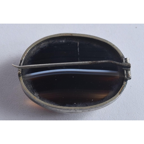 1744 - AN ANTIQUE BANDED AGATE SILVER BROOCH. 15 grams. 4 cm x 3 cm.