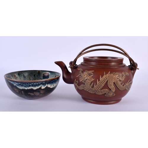 2009 - A CHINESE REPUBLICAN PERIOD YIXING POTTERY TEAPOT AND COVER together with a slip decorated bowl. Lar... 