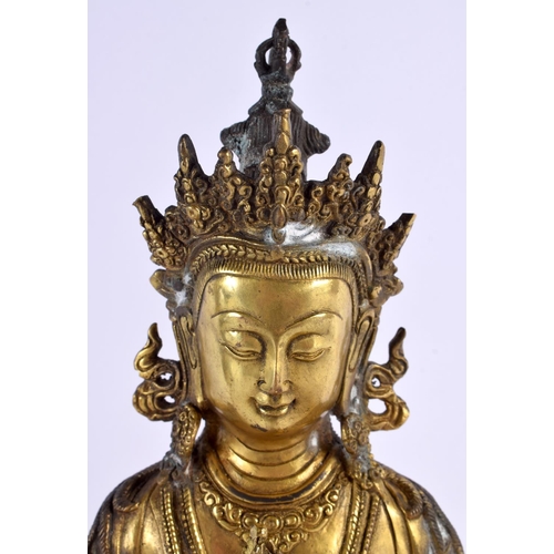 2027 - A LARGE EARLY 20TH CENTURY CHINESE TIBETAN BRONZE FIGURE OF AMITAYUS modelled holding aloft a stupa.... 