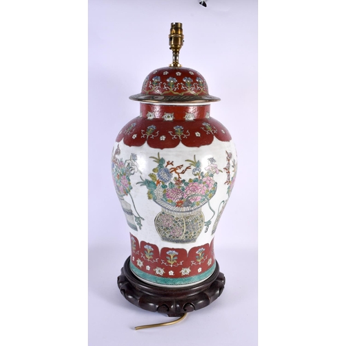 2039 - A LARGE CHINESE FAMILLE ROSE PORCELAIN LAMP 20th Century, painted with flowers. 60 cm x 22 cm.