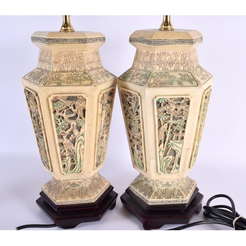 2040 - A PAIR OF CHINESE CARVED AND PAINTED BONE LAMPS 20th Century, decorated with birds and foliage. 60 c... 