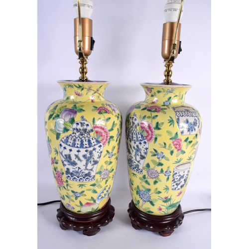 2041 - A PAIR OF CHINESE FAMILLE JAUNE PORCELAIN LAMPS 20th Century. 62 cm high.