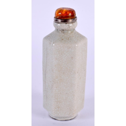 2046 - A CHINESE QING DYNASTY GE TYPE HEXAGONAL SNUFF BOTTLE with amber stopper. 8.5 cm high.