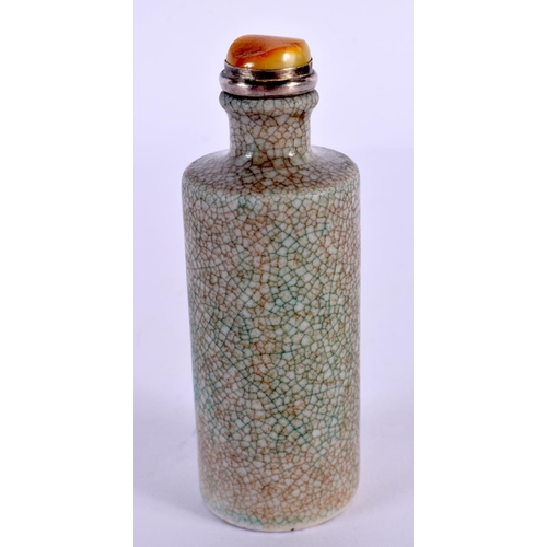 2047 - A CHINESE QING DYNASTY GUAN TYPE CYLINDRICAL SNUFF BOTTLE with amber stopper. 8.5 cm high.