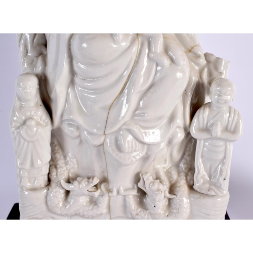 2051 - A LARGE 17TH CENTURY CHINESE BLANC DE CHINE PORCELAIN FIGURE OF JUSHRI Ming/Qing, together with a ra... 