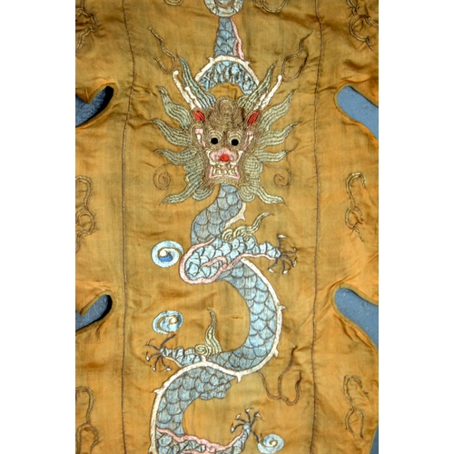 2054 - A PAIR OF 19TH CENTURY CHINESE ORANGE SILK EMBROIDERED DRAGON PANELS together with other similar sil... 