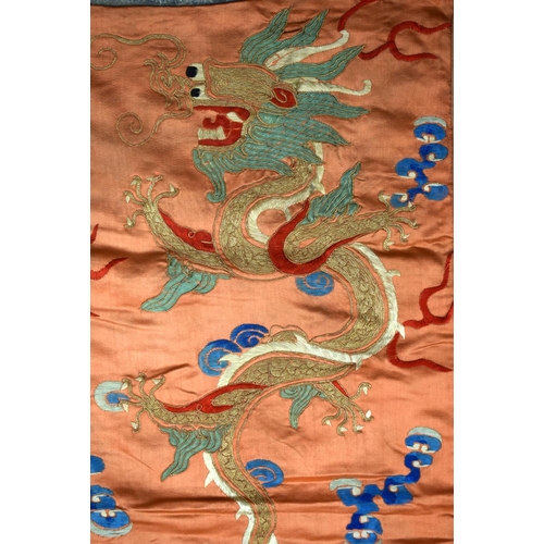 2054 - A PAIR OF 19TH CENTURY CHINESE ORANGE SILK EMBROIDERED DRAGON PANELS together with other similar sil... 